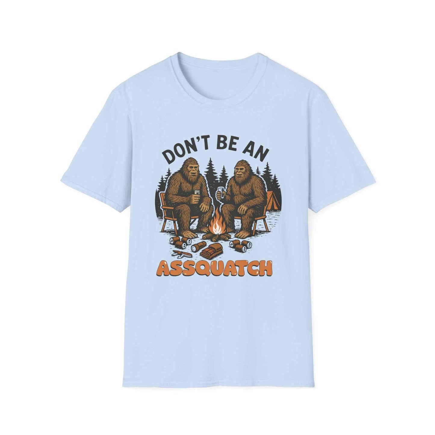 Funny Sasquatch Camping T-Shirt with cartoon Bigfoot sitting by campfire and "Don't be an Assquatch" text on light blue shirt